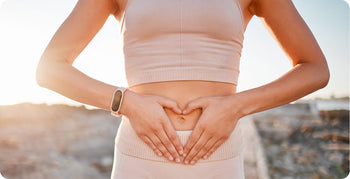 a woman holding her gut 
