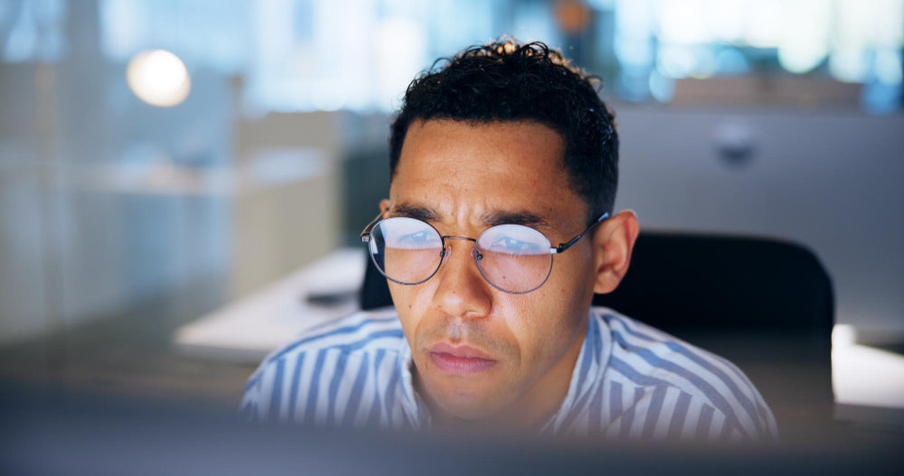 man at the office tired and fatigued during working hours