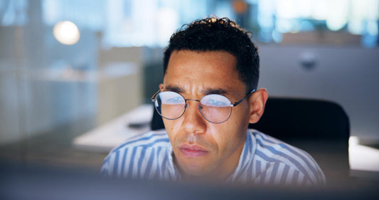 man at the office tired and fatigued during working hours