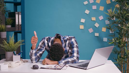 Man falling asleep at his desk 
